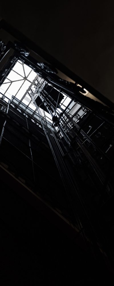 A shaft of an elevator from the inside shot from below